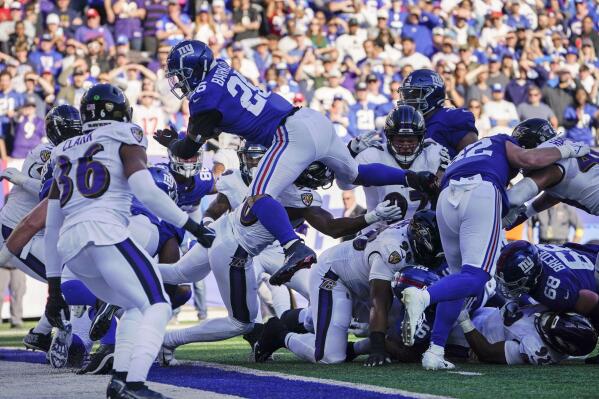 Giants rally from 10 down top Ravens 24 20 on Barkley s run AP News